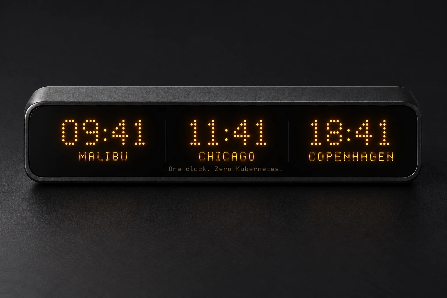 Amber clocks for Malibu, Chicago, and Copenhagen, with the demo joke: One clock. Zero Kubernetes.